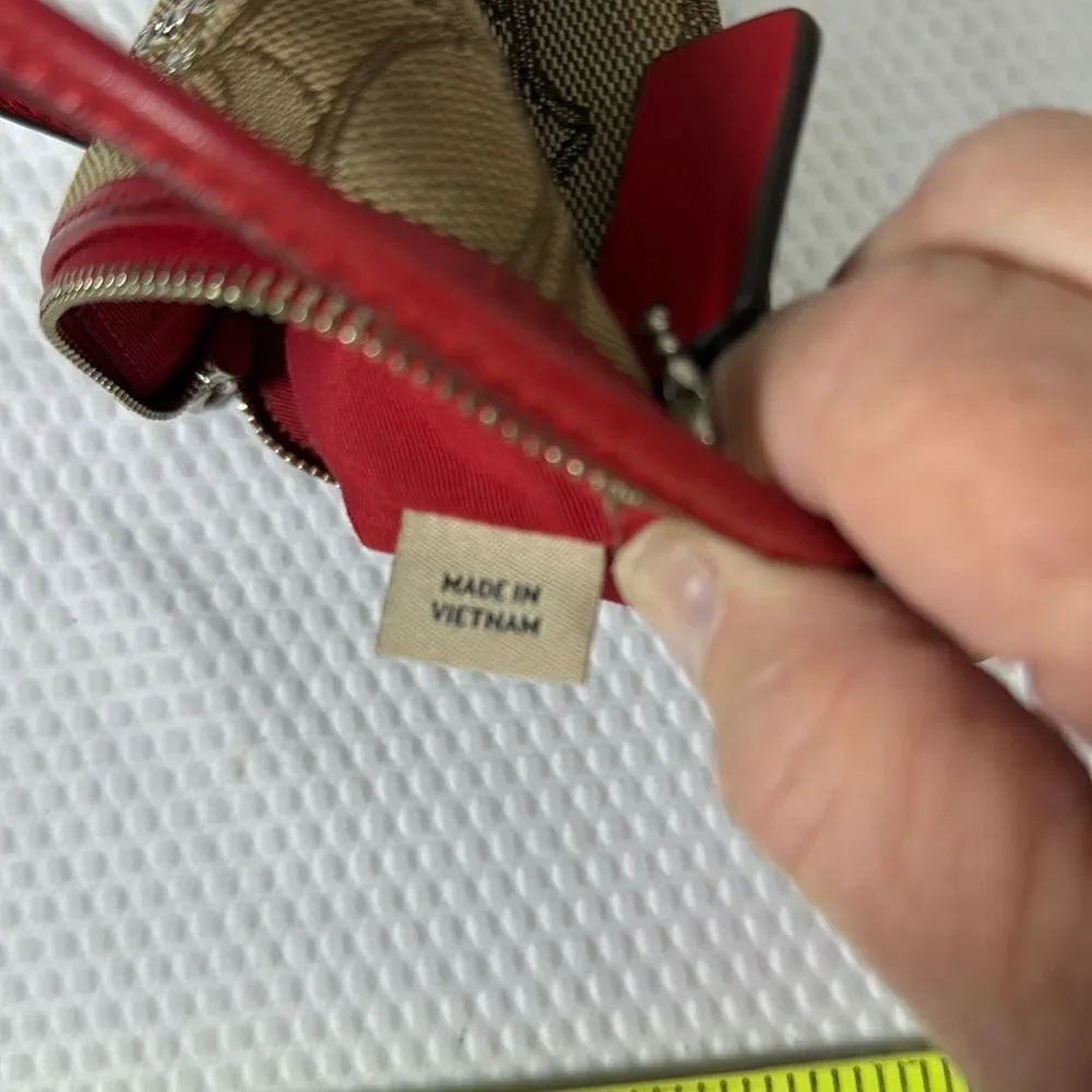 Coach tan and red Wristlet with Logo Pattern